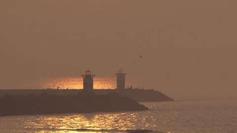 Sunset at scheveningen harbour mouth Stock Footage 94359853