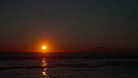 Sunset on the sea against the backdrop of mountains Stock Footage 239546166