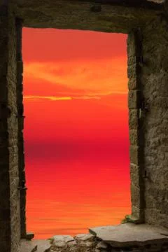 Sunset sea ancient window Stock Photos