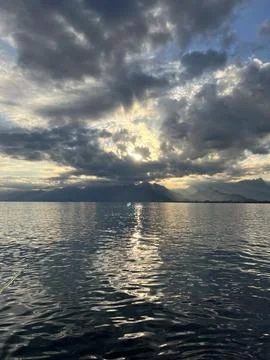 Sunset on the sea and clouds Stock Photos