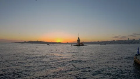 Sunset, sea and historical maiden tower from Istanbul Üsküdar beach Stock Footage