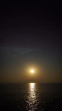 Sunset in the sea and reflection in the water Stock Photos