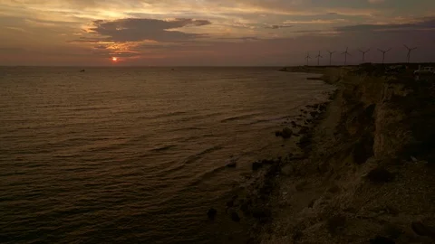 Sunset at the sea and wind roses Stockbeeldmateriaal 111127401