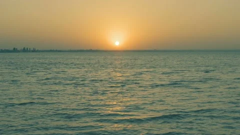 Sunset on the sea beach 4K. FULL HD, 3840x2160. Two men in a boat Stock Footage 90984735