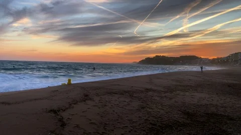 Sunset on a sea beach in Lloret de Mar. Catalonia, Spain Stock Footage 274396137