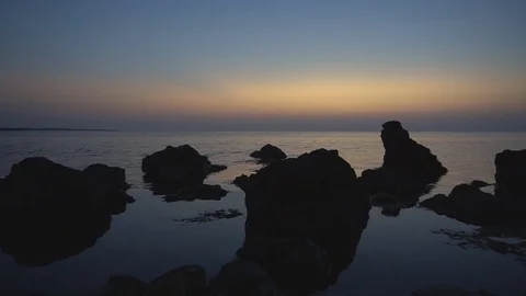 Sunset in the sea on the beach at the ocean Stock Footage 80837318