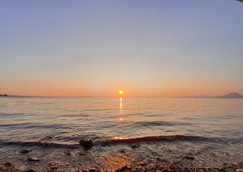 Sunset on the sea beach. Stock Photos