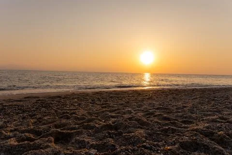 A sunset on the sea beach Stock Photos