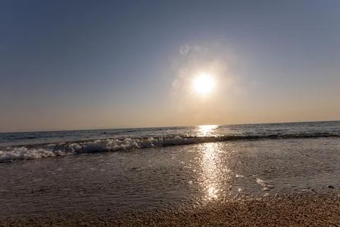 A sunset on the sea beach Stock Photos