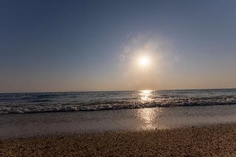 A sunset on the sea beach Stock Photos