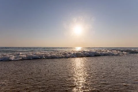 A sunset on the sea beach Stock Photos