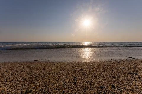 A sunset on the sea beach Stock Photos