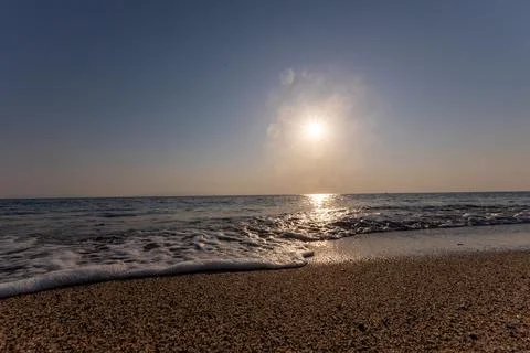 A sunset on the sea beach Stock Photos