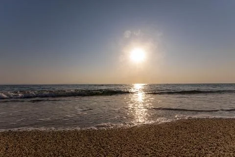 A sunset on the sea beach Stock Photos