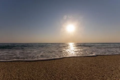 A sunset on the sea beach Stock Photos