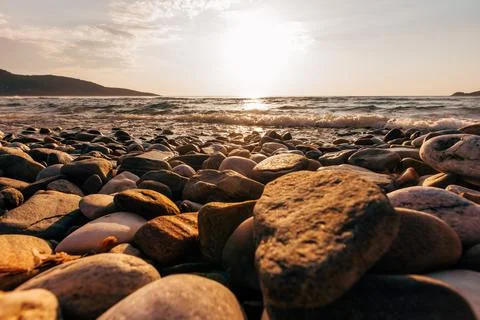 A sunset on the sea beach Stock Photos