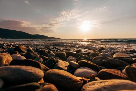 A sunset on the sea beach Stock Photos