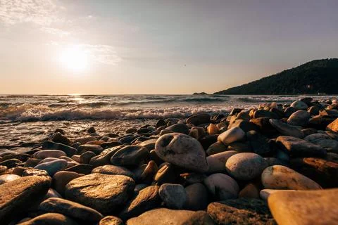 A sunset on the sea beach Stock Photos