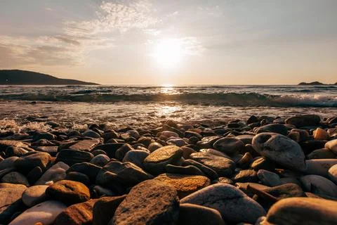 A sunset on the sea beach Stock Photos