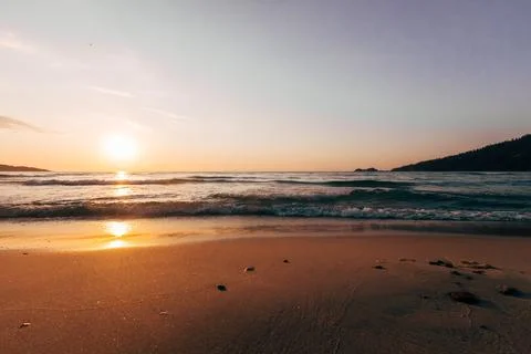 A sunset on the sea beach Photos