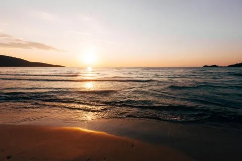A sunset on the sea beach Stock Photos