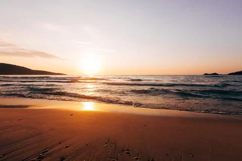 A sunset on the sea beach Stock Photos