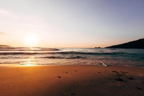 A sunset on the sea beach Stock Photos