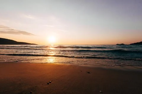 A sunset on the sea beach Stock Photos