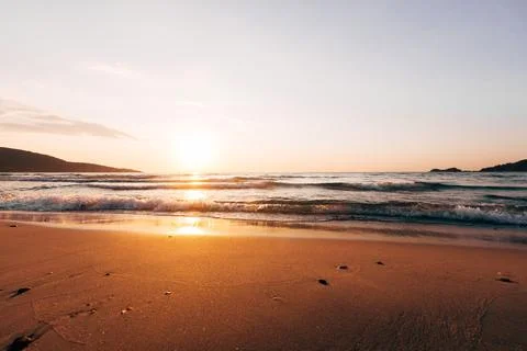 A sunset on the sea beach Stock Photos
