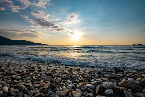 A sunset on the sea beach Stock Photos