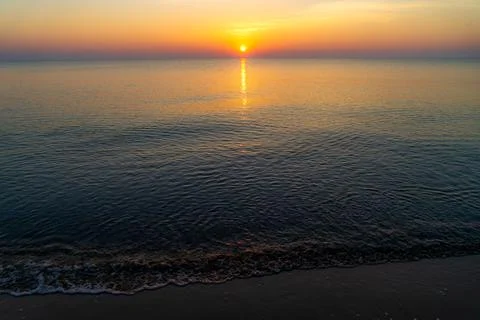 Sunset with sea beach Stock Photos