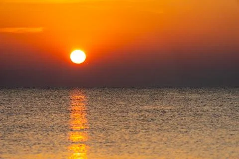 Sunset with sea beach Stock Photos
