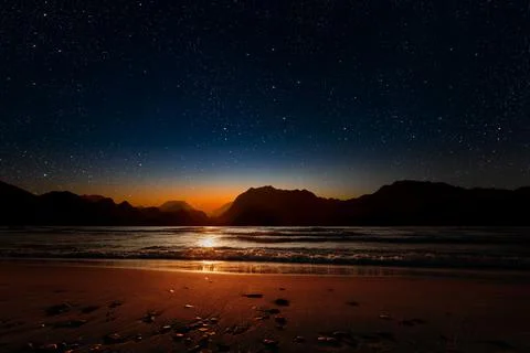 A sunset on the sea beach Stock Photos