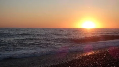 Sunset on sea beach in stormy day Stock Footage