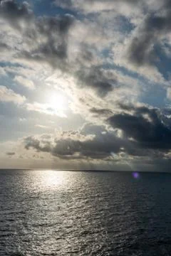 Sunset on the sea with beautiful cloud patterns Stock Photos