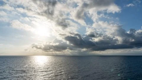 Sunset on the sea with beautiful cloud patterns Stock Photos