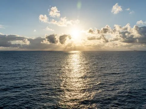 Sunset on the sea with beautiful cloud patterns Stock Photos
