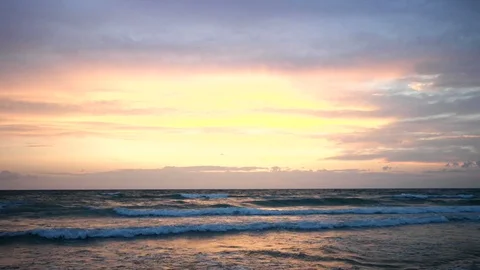 The sunset at the sea with a beautiful colored sky in Salento Stock Footage 128929614