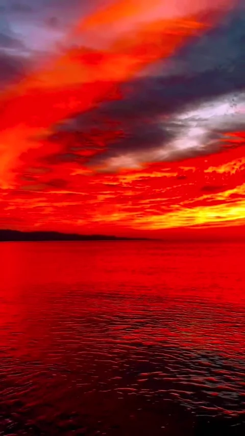 Sunset in the sea with Black Clouds Stock Footage 234553407