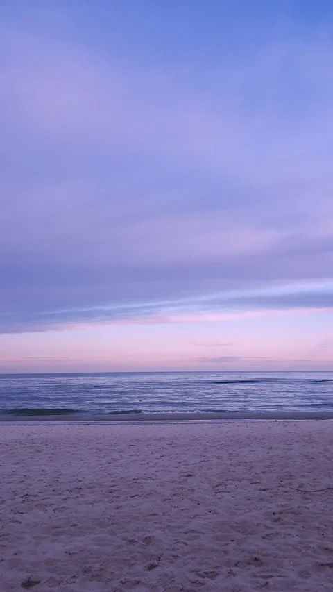 Sunset at sea. Blue clouds over water and pink blue horizon Stock Footage 173421600