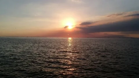 Sunset on the sea in the city of Manila Stock Footage 130189953