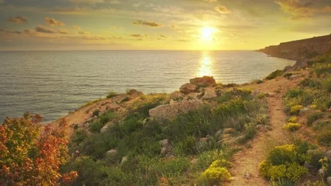 Sunset on sea cliffs.  Video stock 195280795