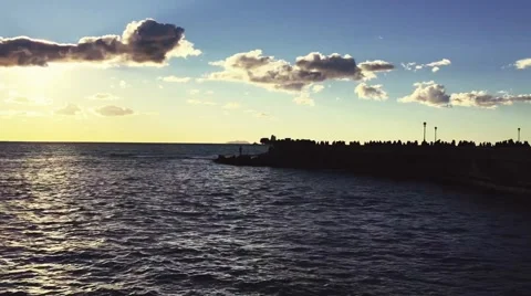 Sunset by the sea with crowd Stock Footage 59139335
