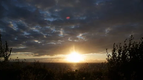 Sunset by the sea - dramatic timelapse Stock Footage 94082032
