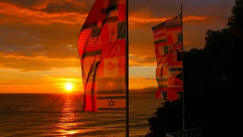 Sunset at Sea with Flags Stock Footage 98416539