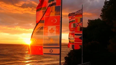 Sunset at Sea with Flags Stock Footage 98416820