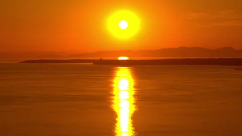 Sunset at sea Stockbeeldmateriaal 297686287