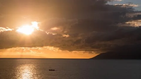 Sunset on sea with large clouds Фото