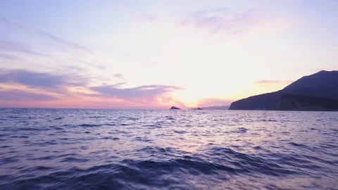 Sunset sea low flyover Stock Footage 121940032