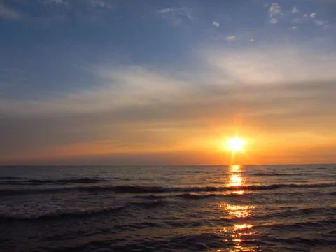 Sunset in the sea Stock Photos